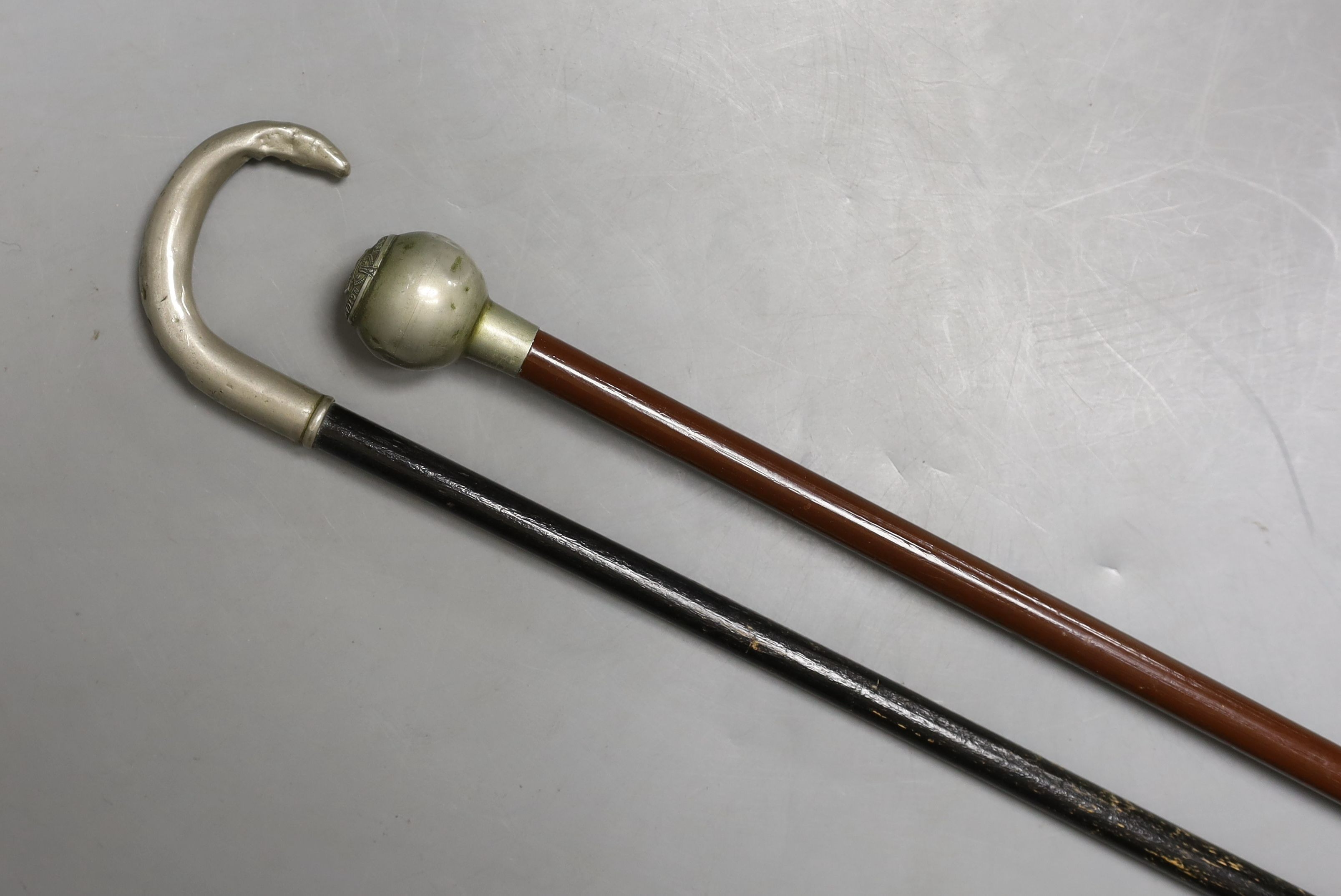 A Victorian officer's sword, two swagger sticks, and a rootwood walking cane (4)